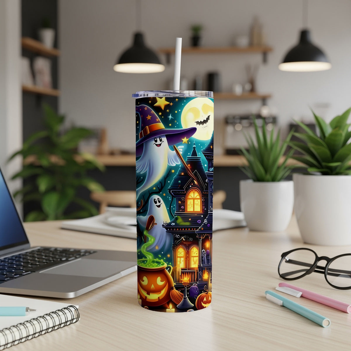 Tall tumbler with Halloween theme: ghosts, haunted house, moon, and pumpkins.