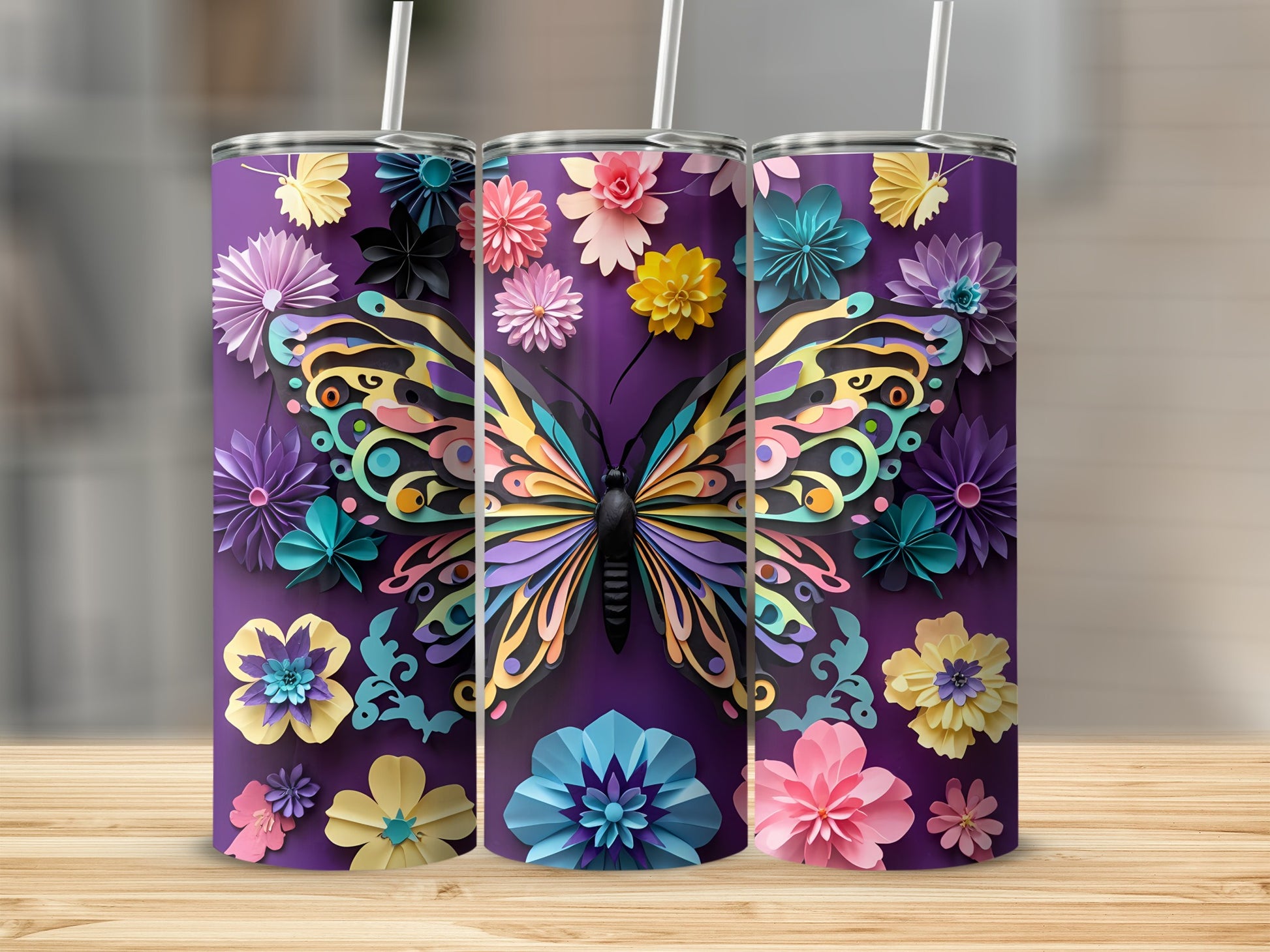 Three purple tumblers with colorful butterfly and paper flower designs.