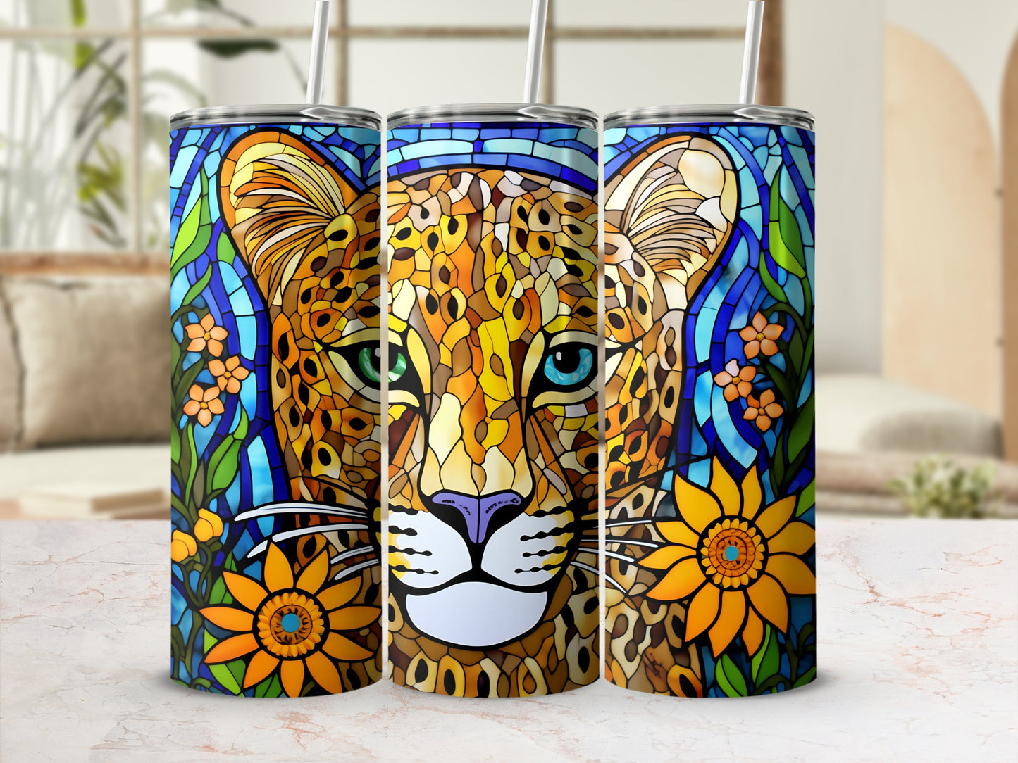 Leopard face with blue eyes and orange flowers on a colorful tumbler.