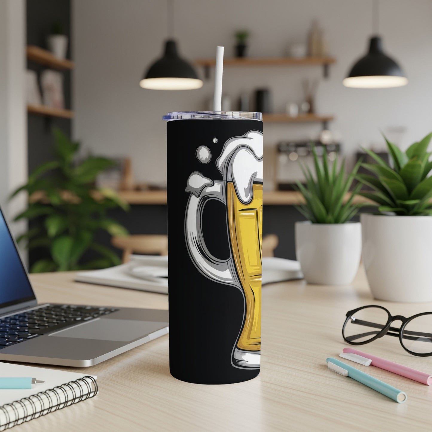 Tall black tumbler with a cartoon beer mug illustration.