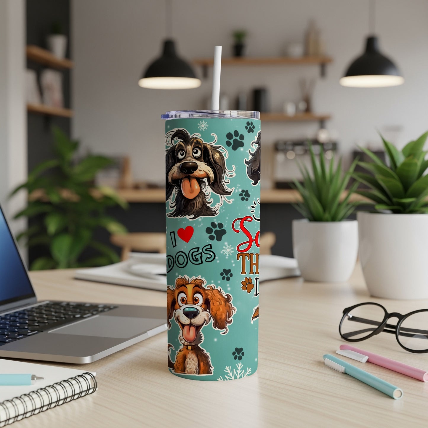 Tumbler with playful dog illustrations and "I Love Dogs" text on teal background.