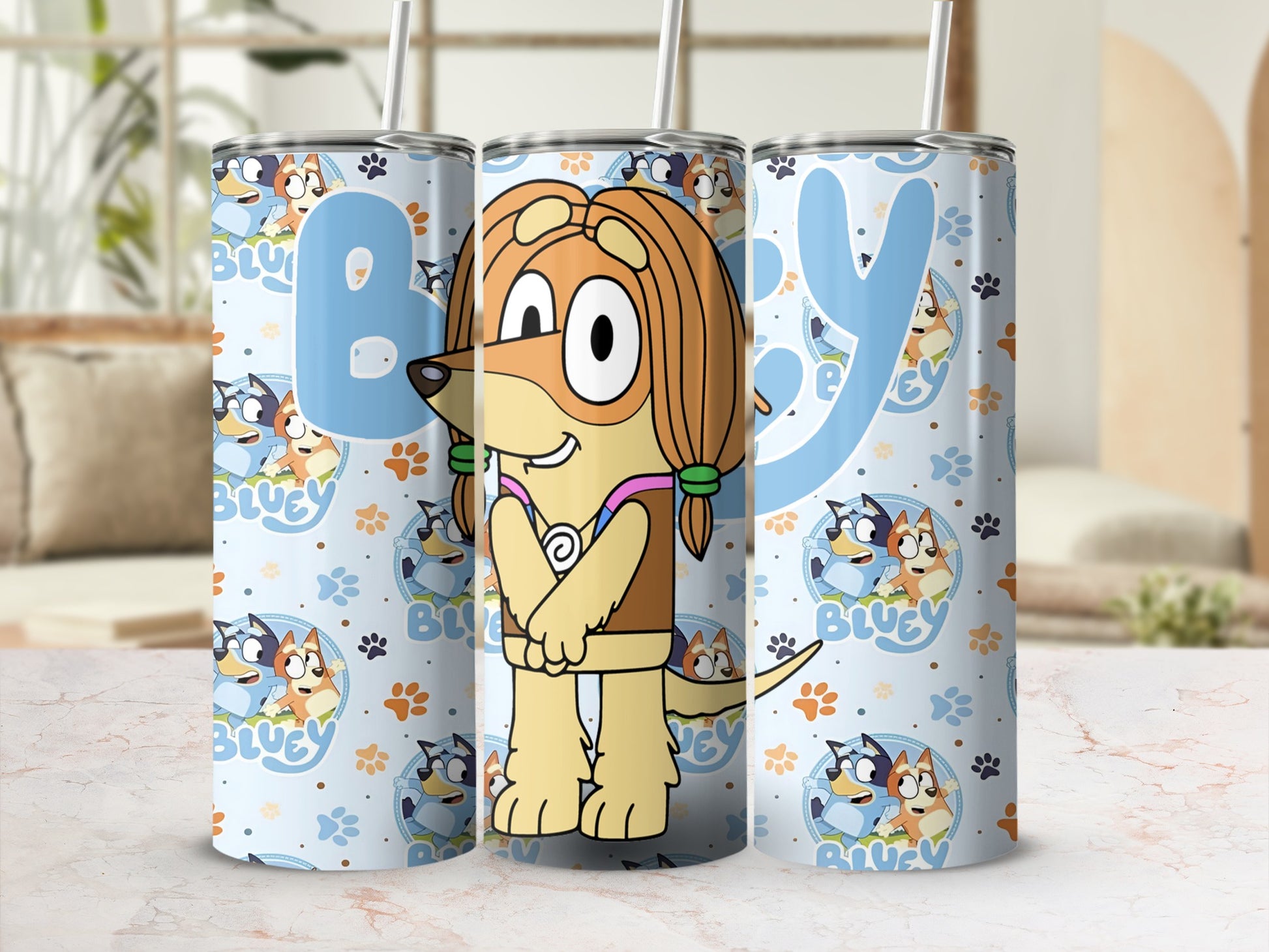 Bluey and Bingo characters on light blue patterned tumbler with straw.