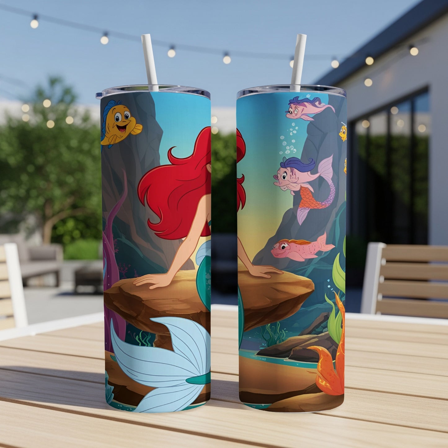 Ariel and friends on a character tumbler with a straw.