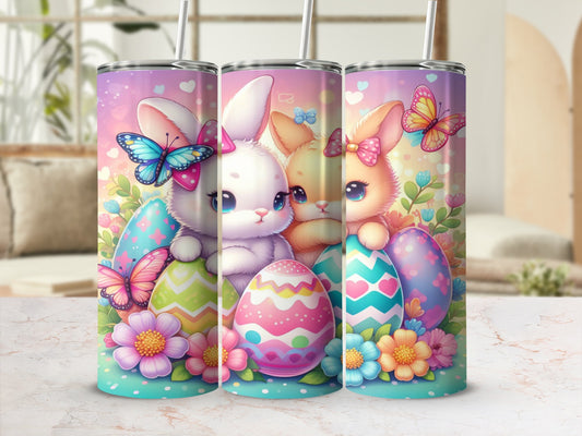 Three pastel tumblers decorated with Easter bunnies, colorful eggs, butterflies, and flowers.
