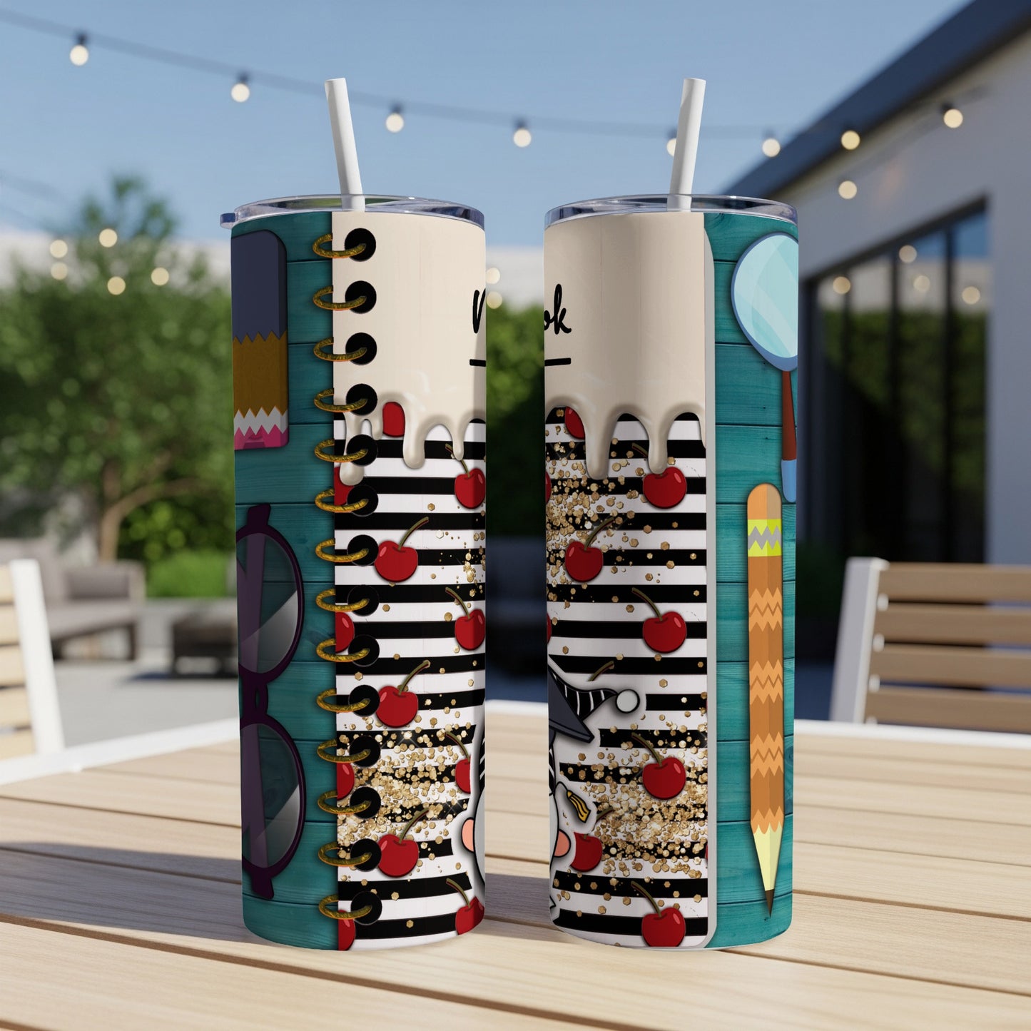 Two tumblers with a school-themed design of cherries, pencils, and books.