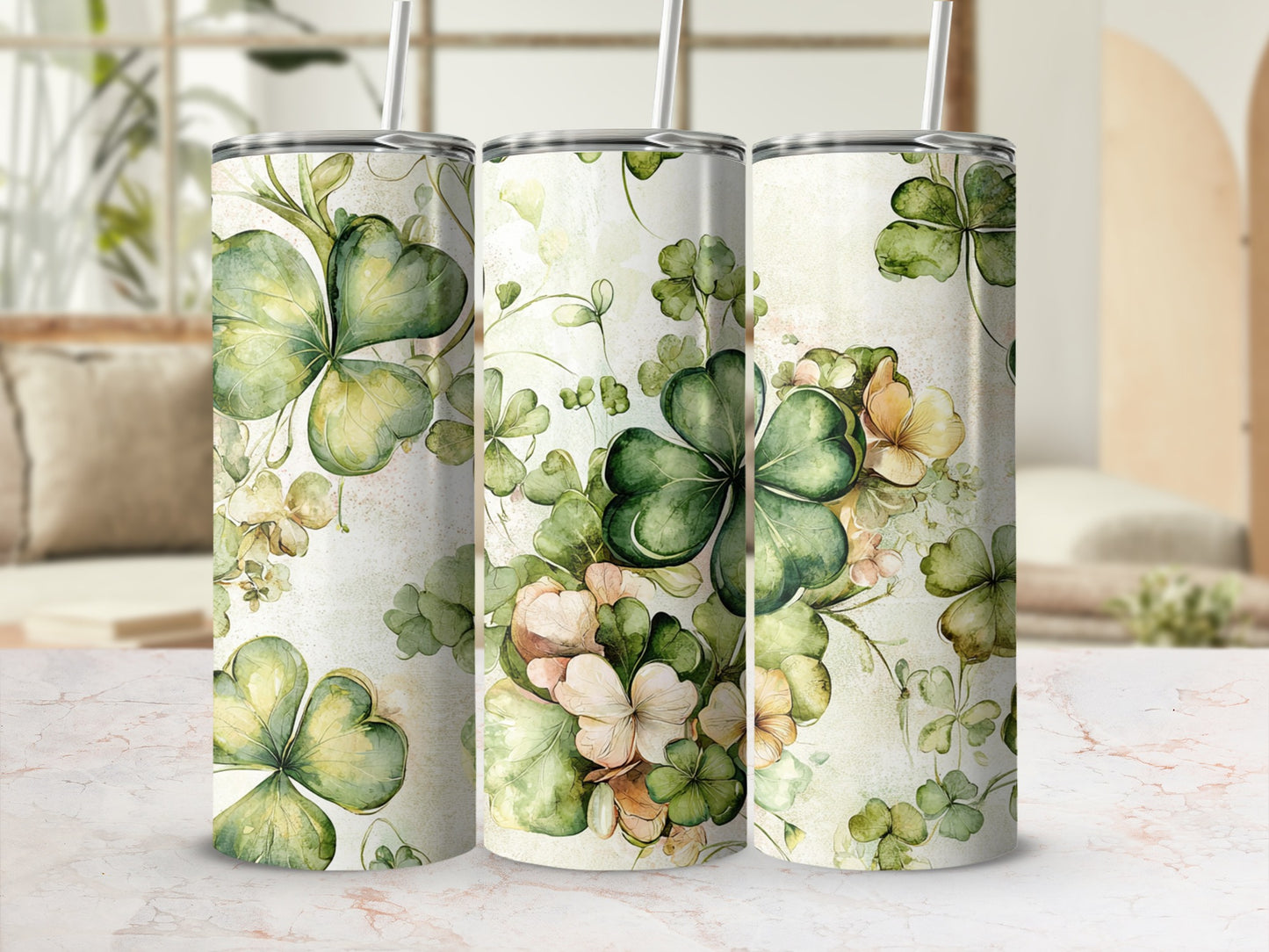 Three tumblers with green and pink shamrock clover design.