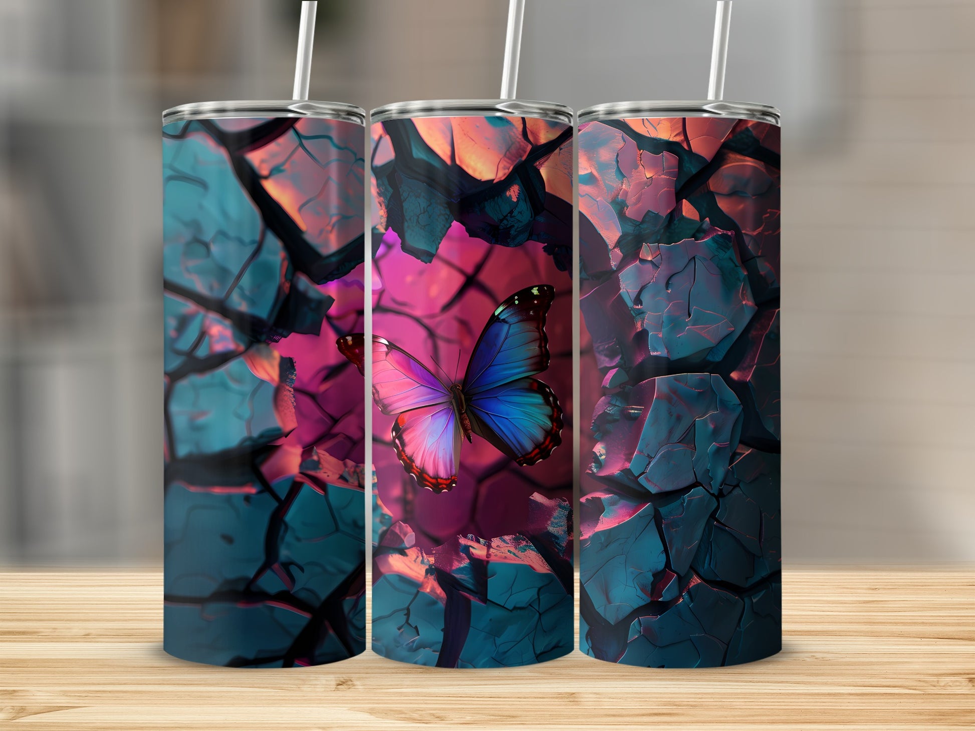 Three tumblers with a cracked blue and pink abstract design and a butterfly.