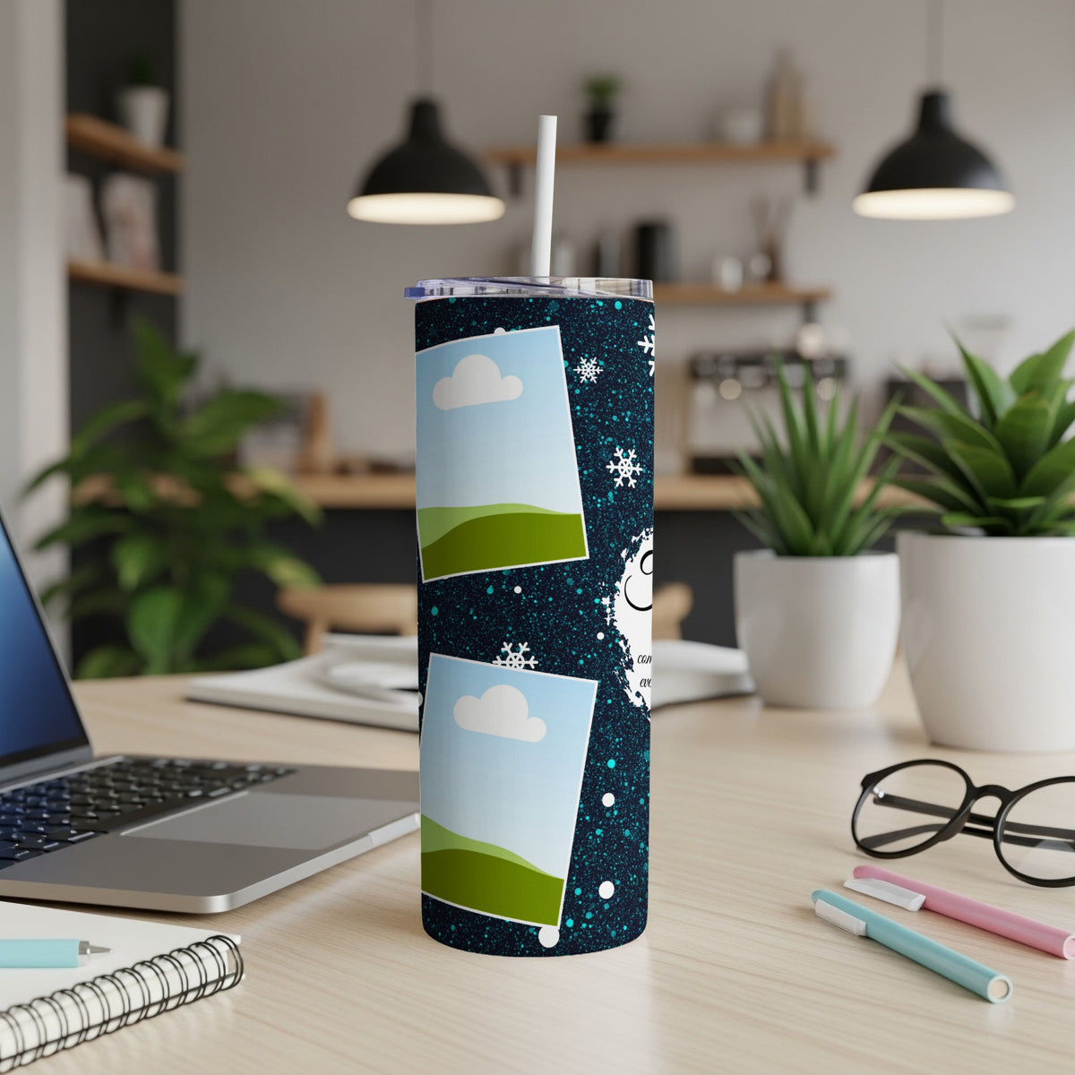 Tumbler with blue speckled design, photos, snowflakes, and text.