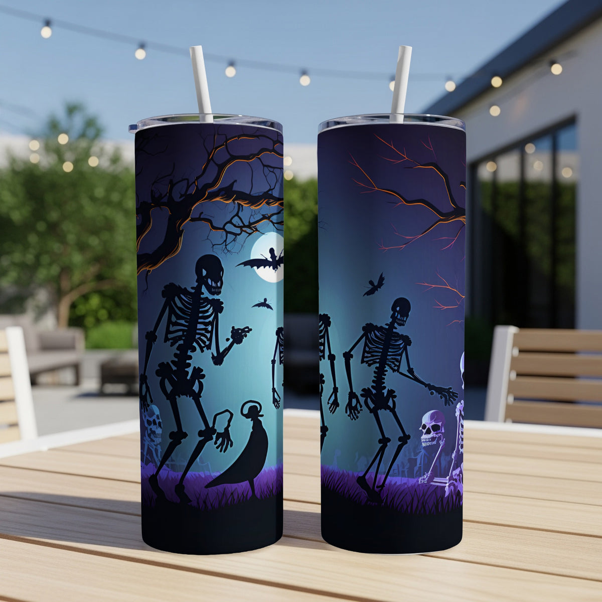 Halloween tumblers with skeleton and bat graphic on a spooky night scene.