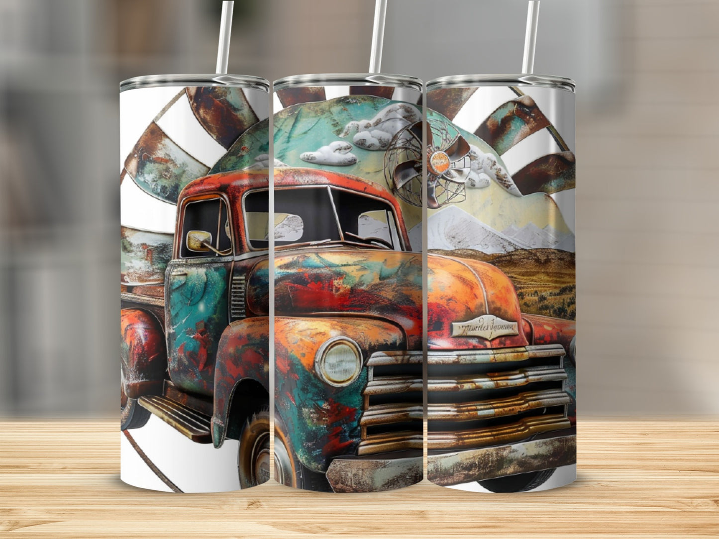 Three tumblers featuring a rusty vintage truck with mountains and clouds design.
