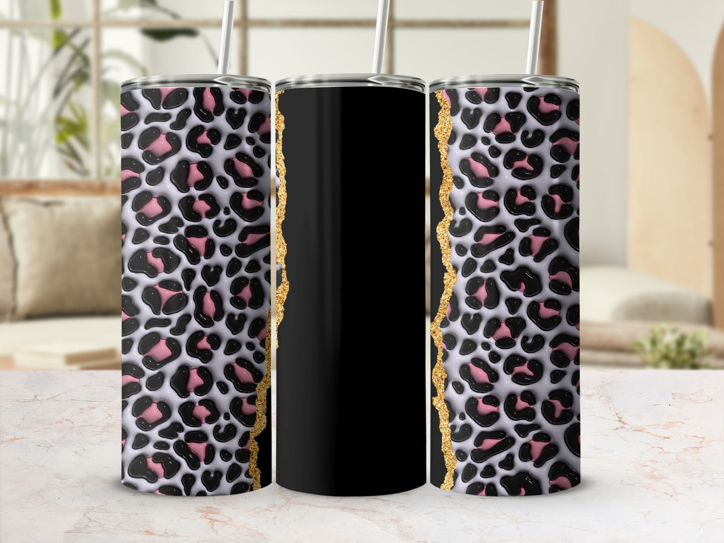 Three tumblers with leopard print and gold accents, one black.