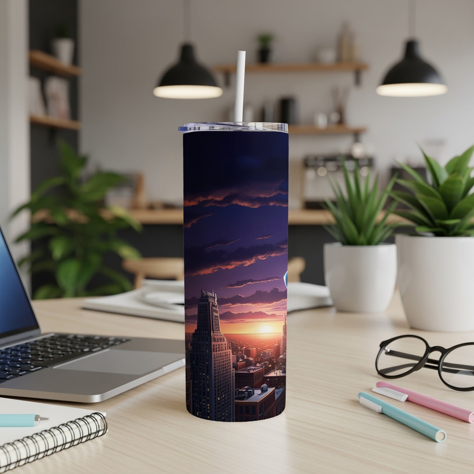 City skyline at sunset on a skinny tumbler with a straw.