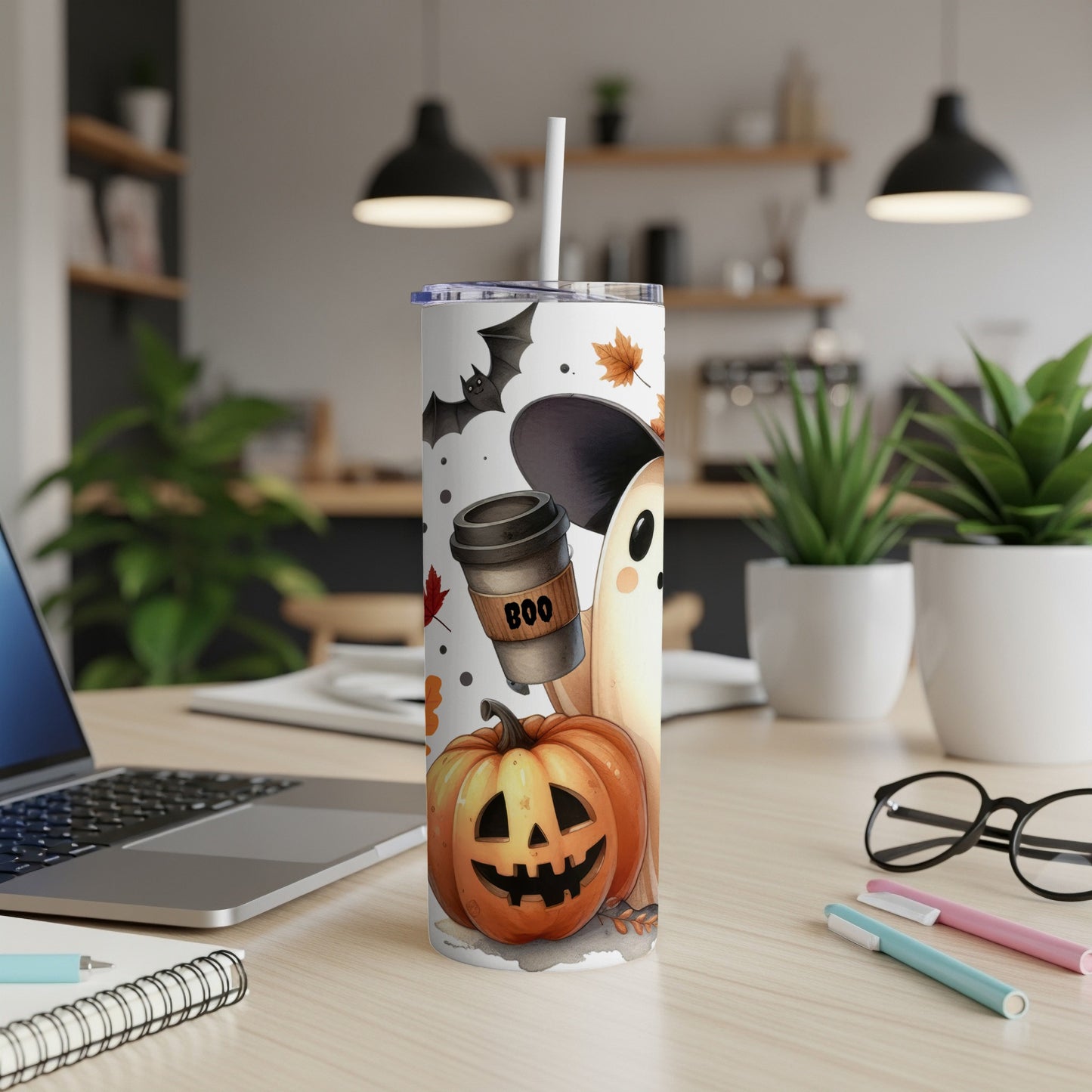 Halloween tumbler with ghost, pumpkin, bat, and coffee cup graphics.