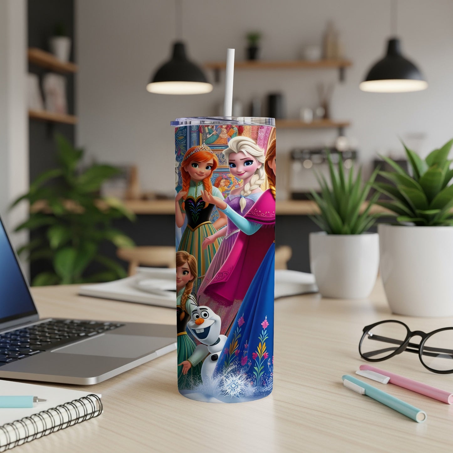 Frozen characters Elsa, Anna, and Olaf on a white insulated tumbler.