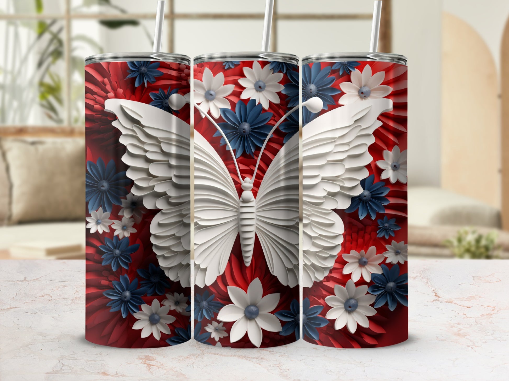 White butterfly and blue and red flowers on a tumbler.