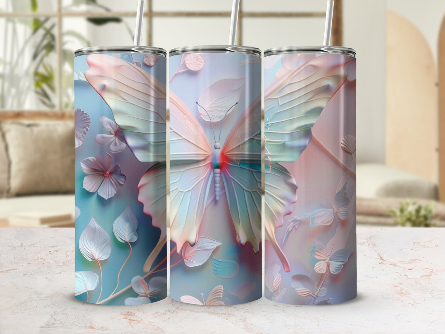 Three tumblers with pastel butterfly and floral patterns.