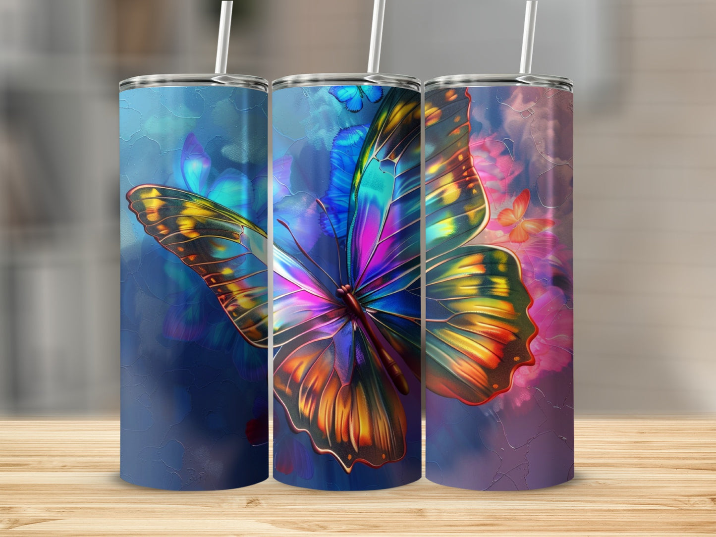 Three tumblers featuring colorful stained-glass butterfly designs on a wooden surface.
