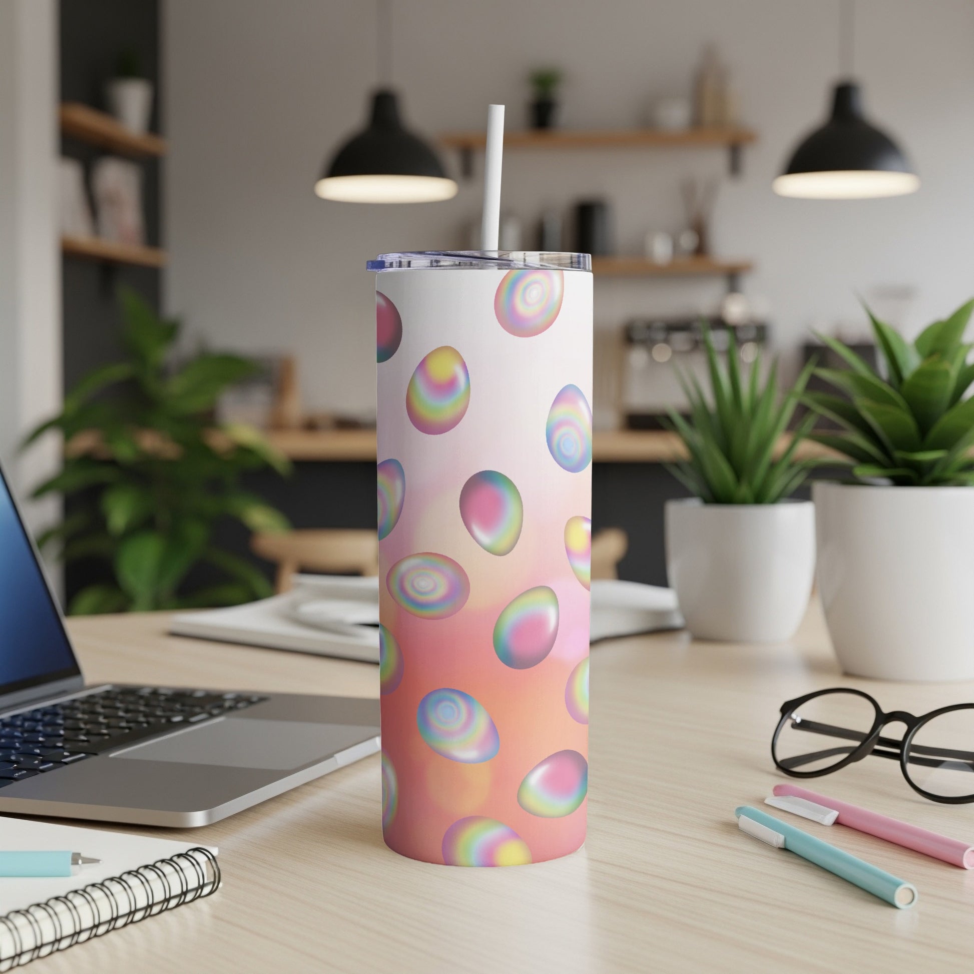 Colorful Easter egg pattern on a white tumbler with a straw.