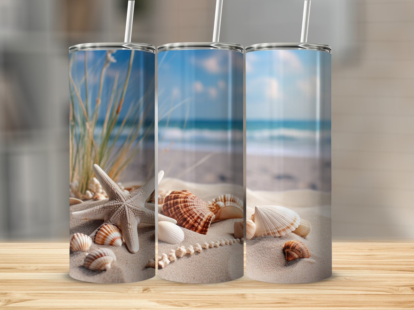 Three tumblers featuring a beach scene with shells and starfish.