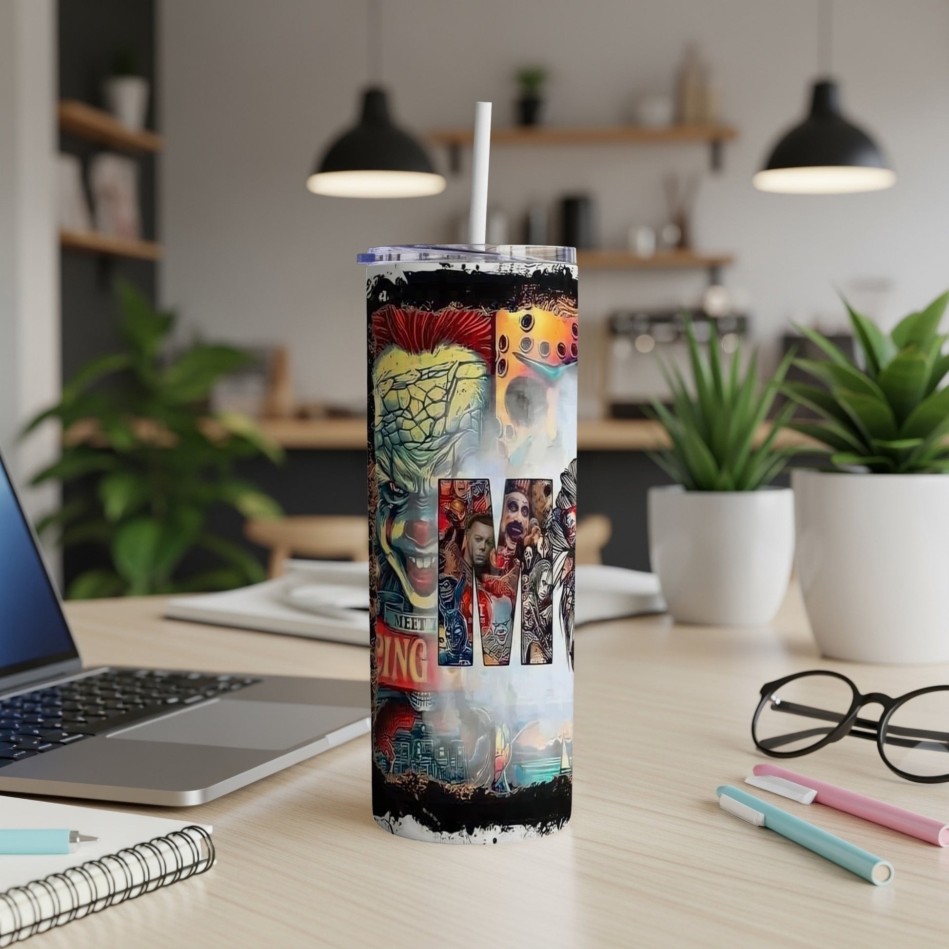 Tumbler with collage of horror movie characters and scenes.