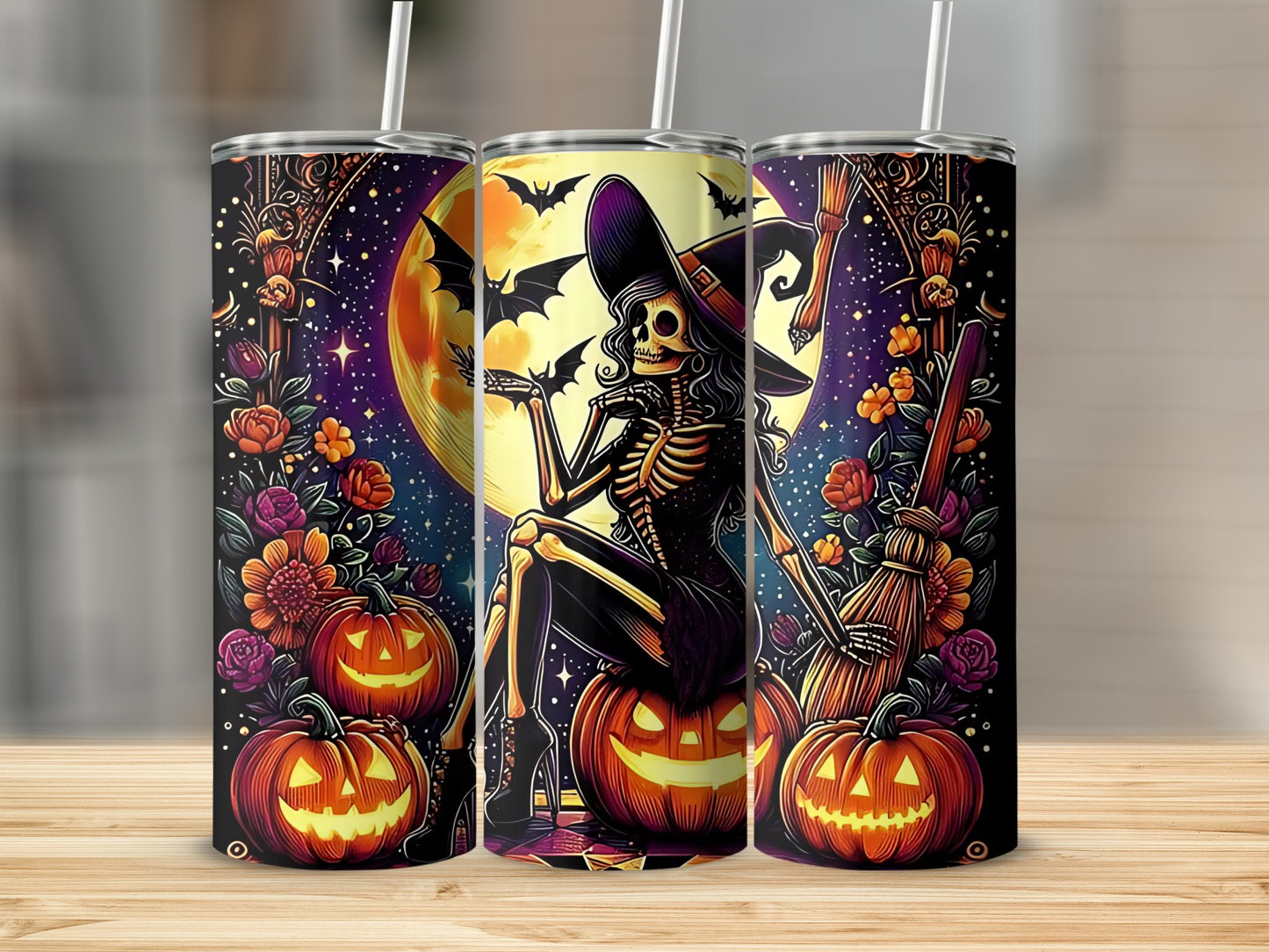 Three Halloween-themed tumblers featuring a skeleton witch, pumpkins, bats, and flowers.