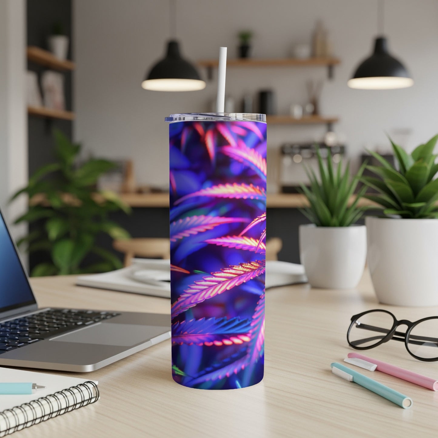 Tumbler with purple and blue cannabis leaf pattern.