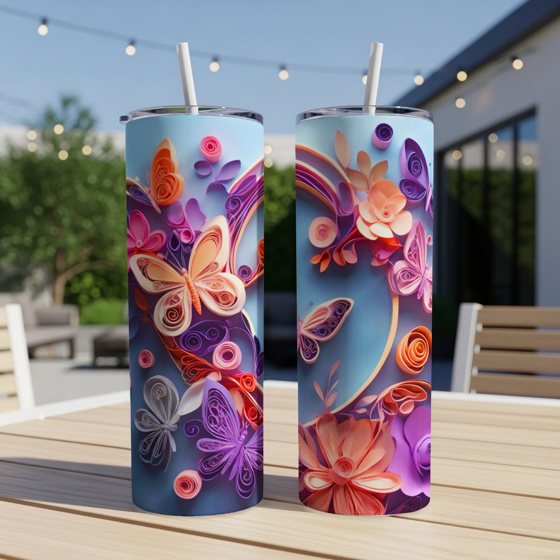 Two tumblers featuring a colorful quill art design of butterflies and flowers.