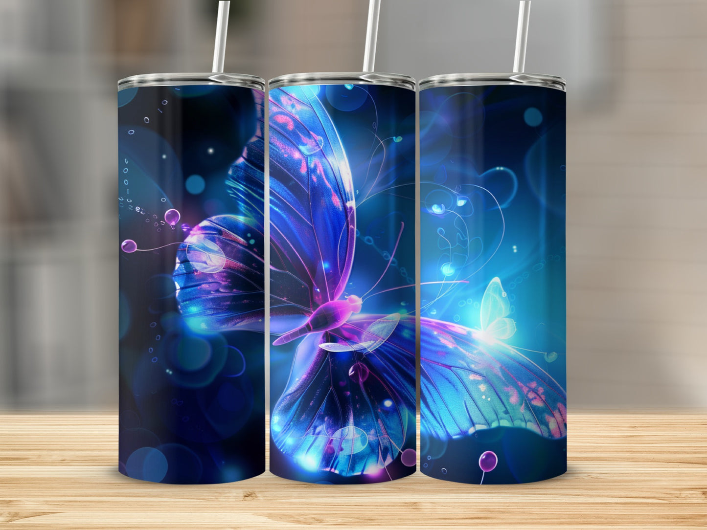 Three tumblers featuring a vibrant, glowing blue and purple butterfly design.