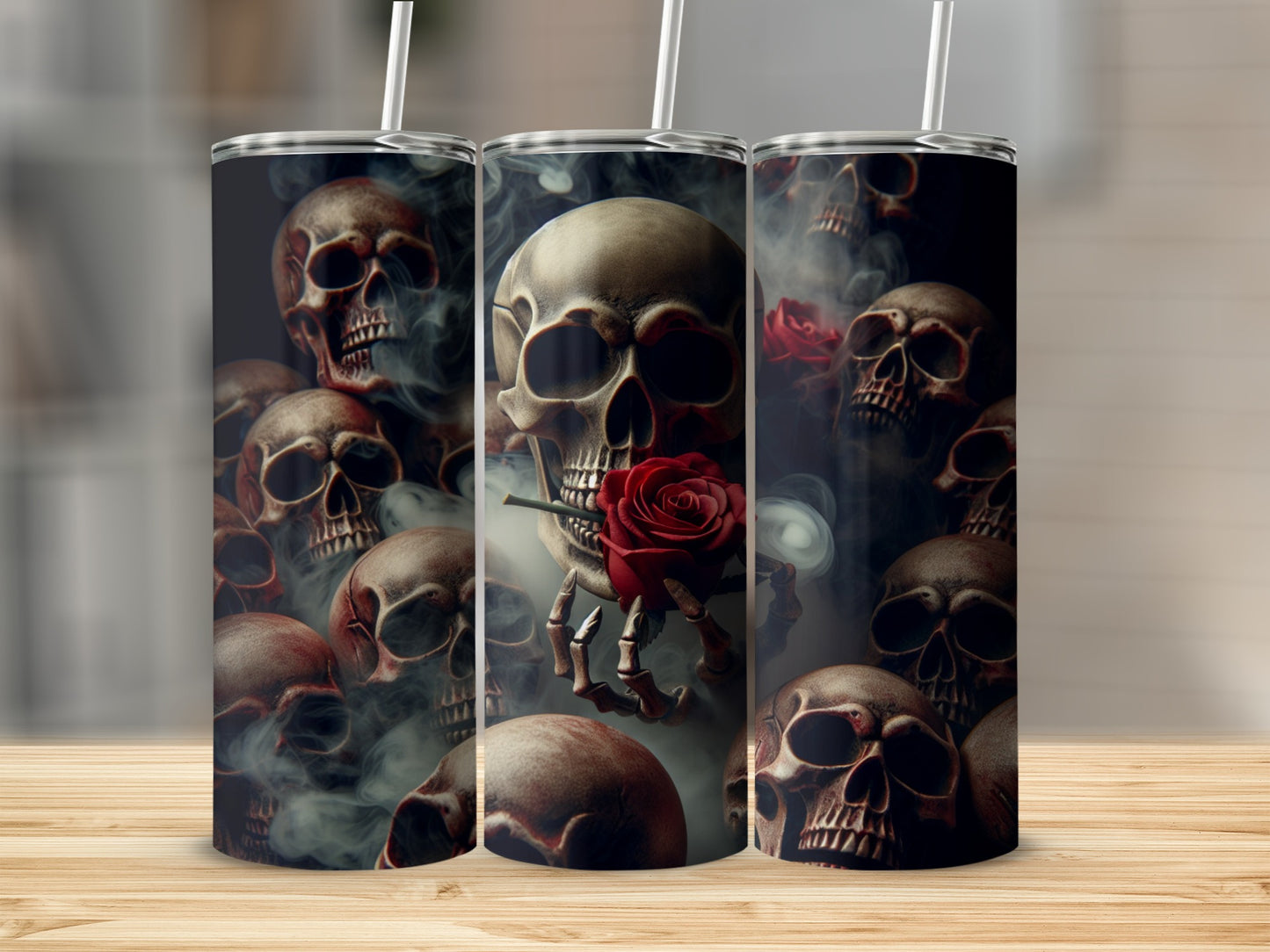 Skulls and roses design on three tumblers with straws.