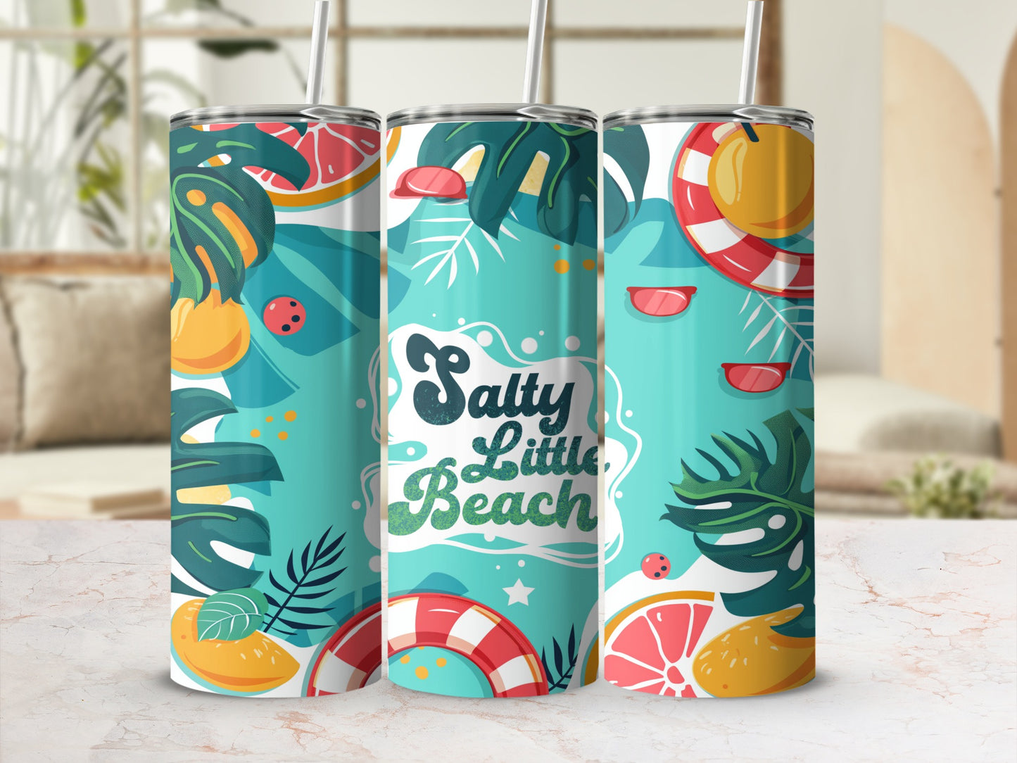 Tumbler with "Salty little Beach" text, tropical leaves, and citrus slices.