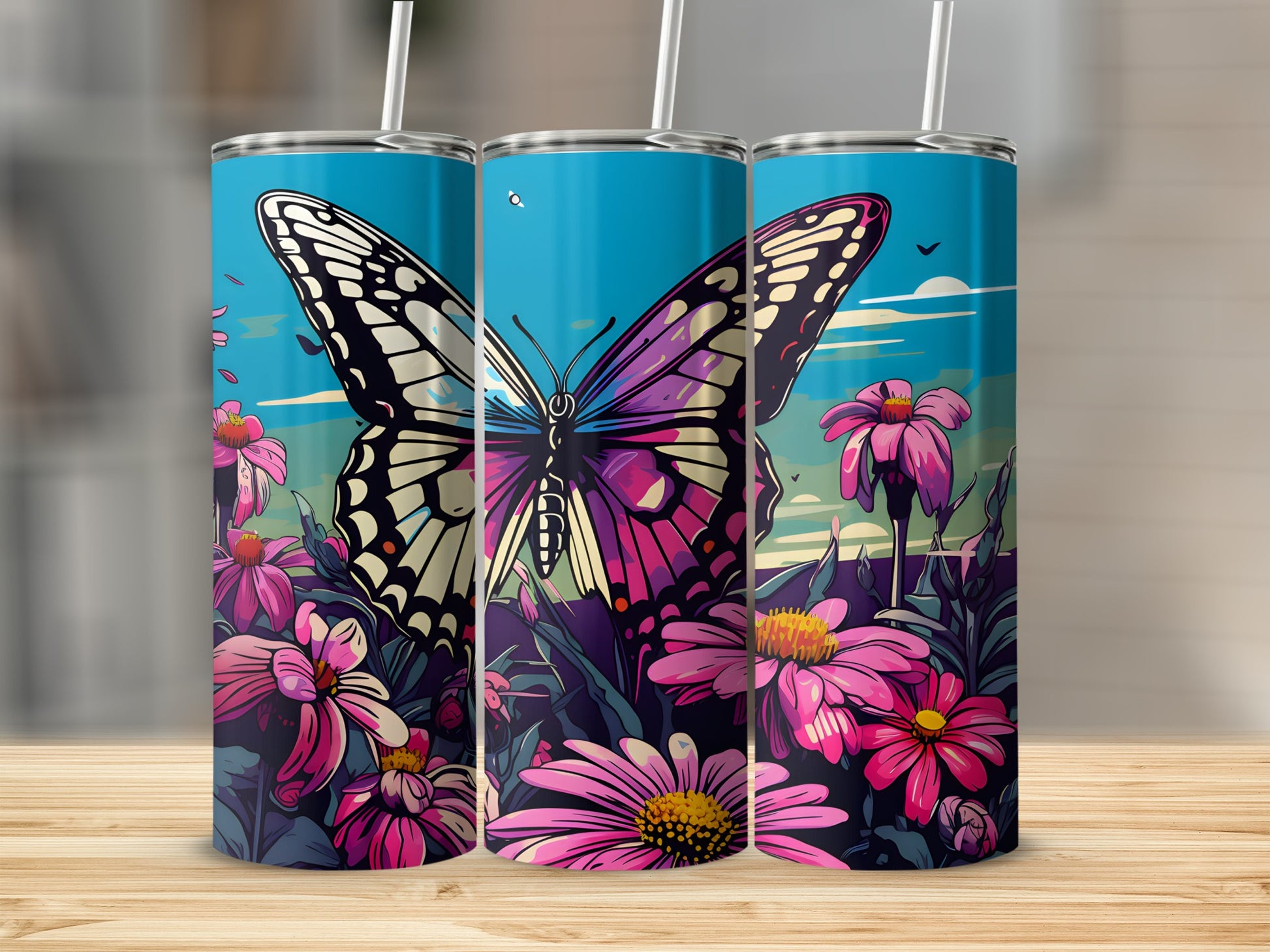 Three tumblers featuring a vibrant butterfly and pink flowers against a blue sky.