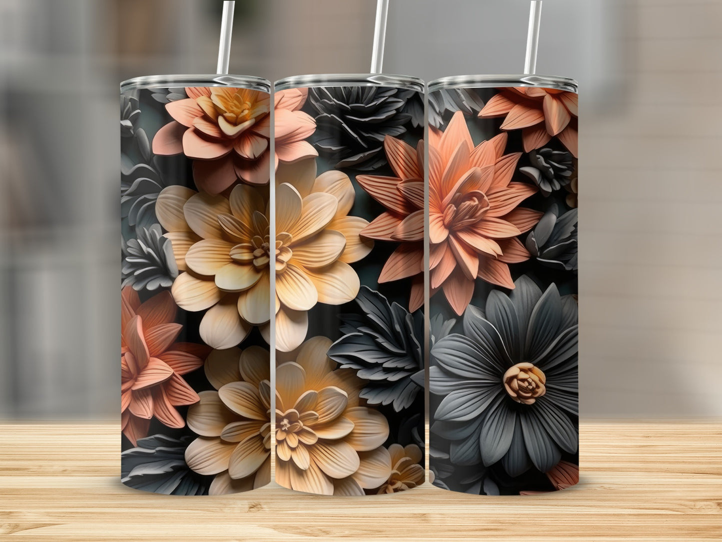 Three tall tumblers with embossed floral designs in coral and gray.