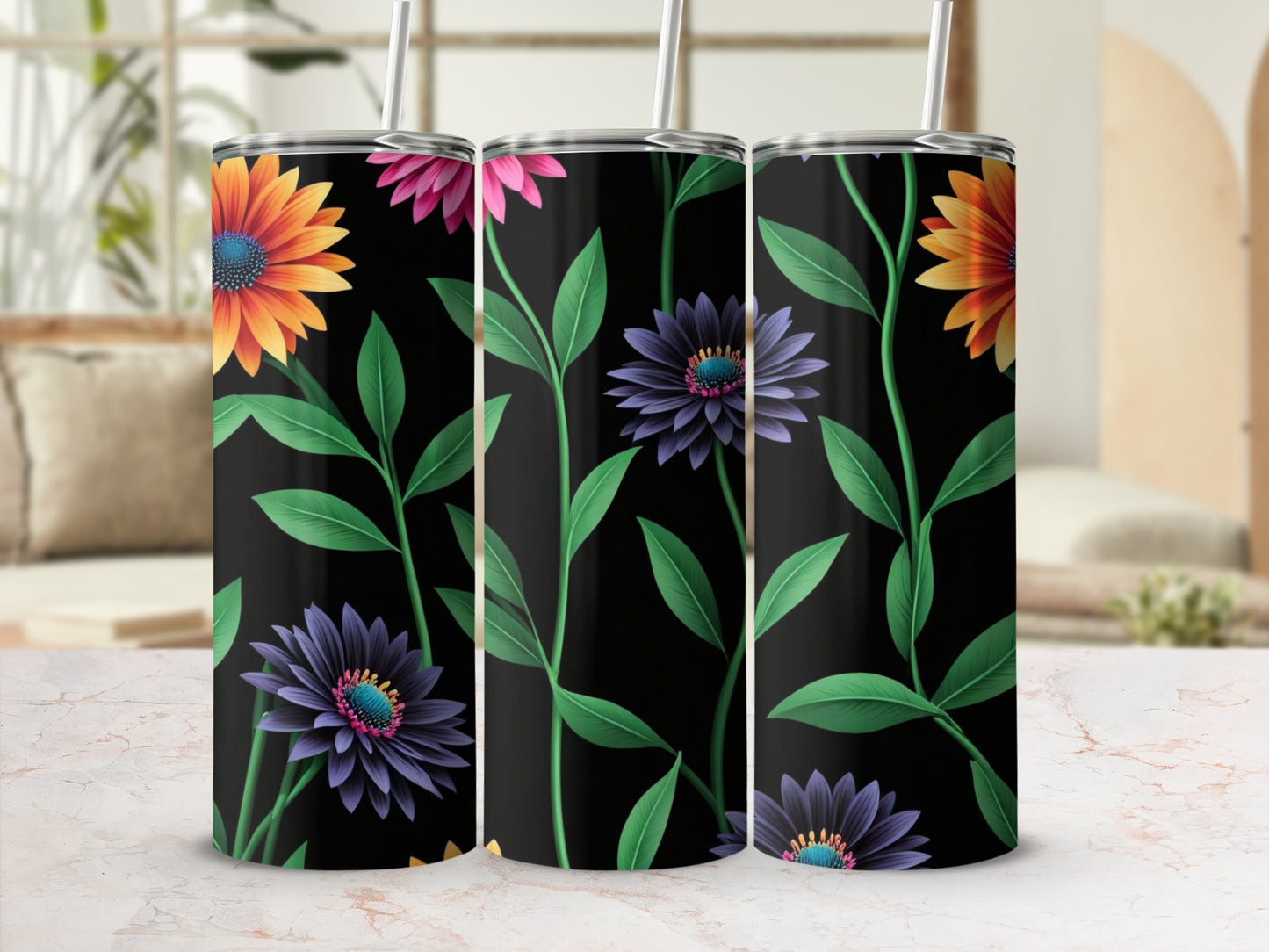 Three tumblers with floral designs on a black background.