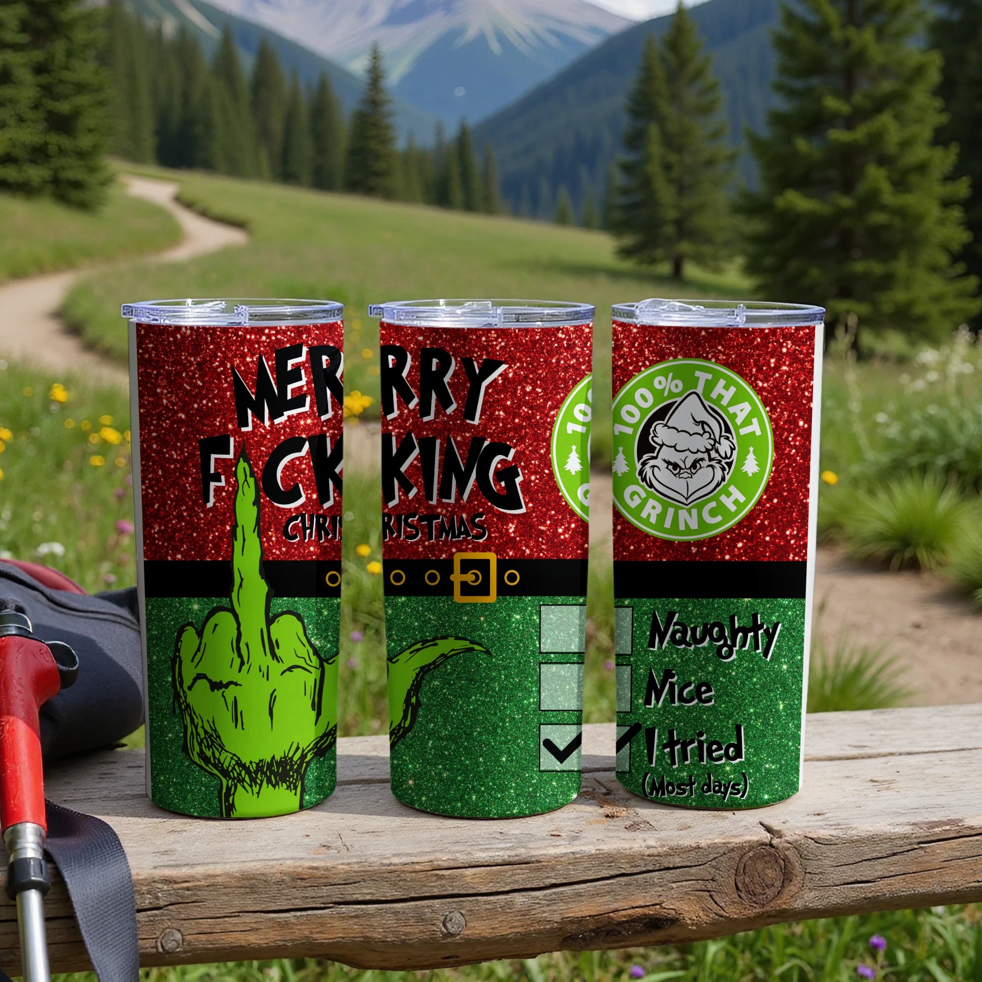 Three green glitter tumblers with Grinch-themed designs and Christmas sayings.