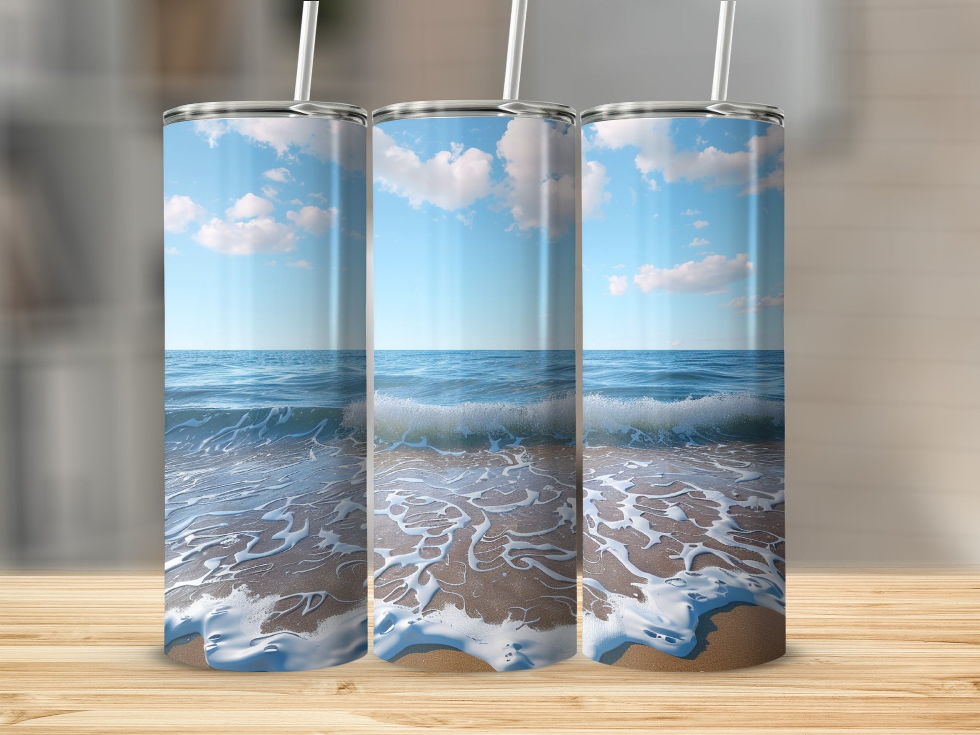 Three tumblers with a beach scene: ocean, waves, and sandy shore.