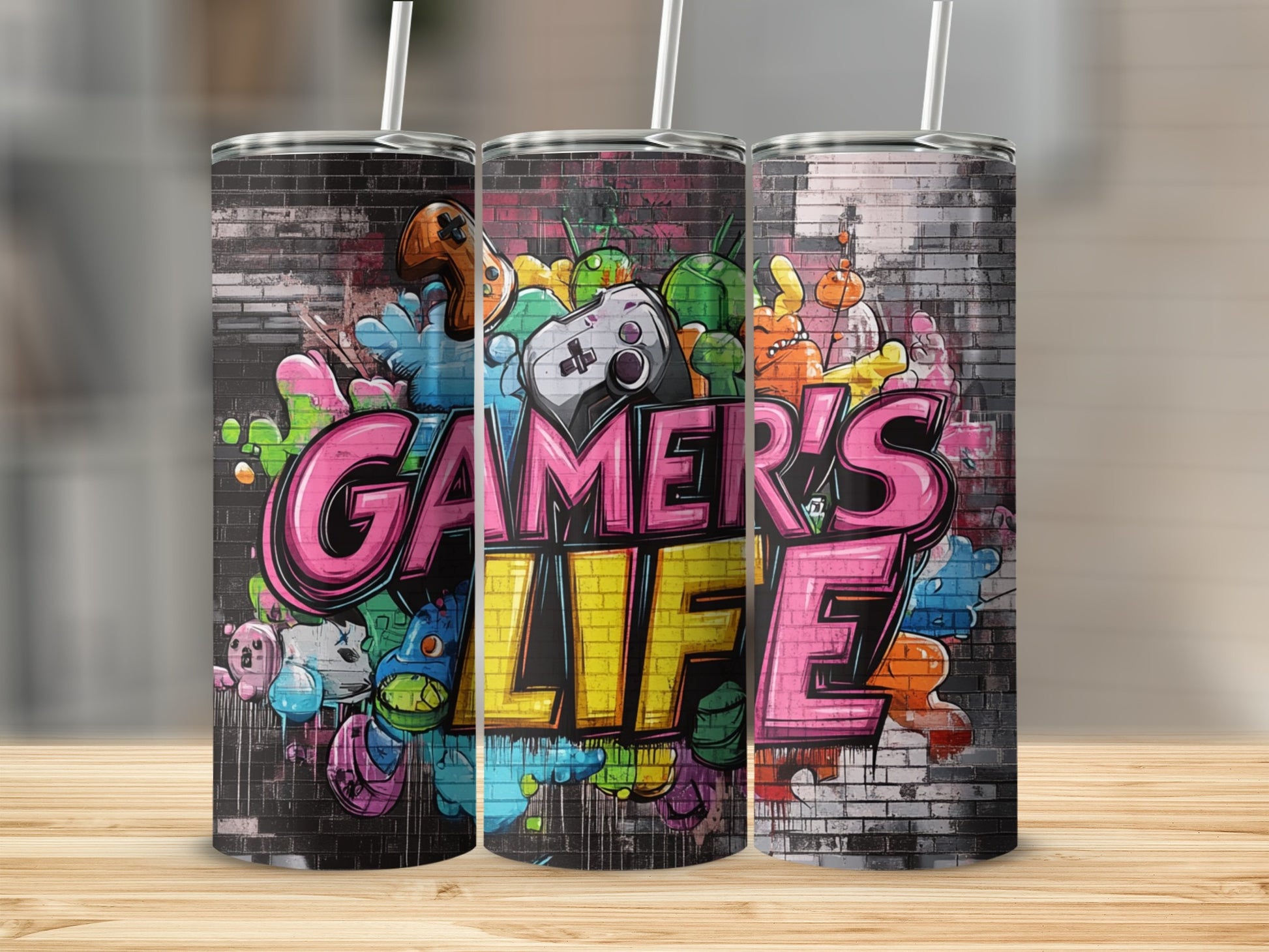 Tumbler with "Gamer's Life" text and colorful graffiti art.