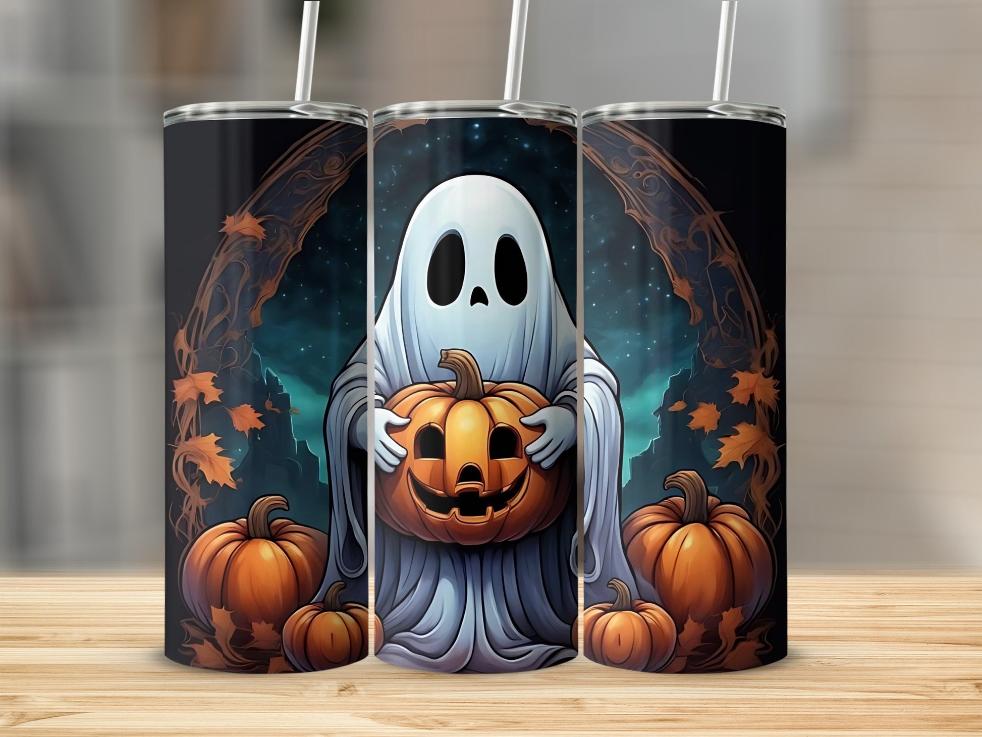 Three tumblers with a ghost holding a jack-o'-lantern and pumpkins design.