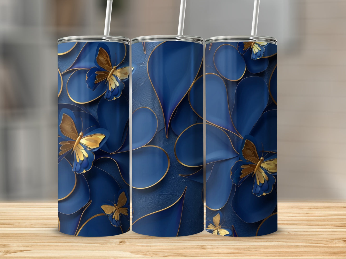 Three tall tumblers with navy blue floral pattern and gold butterflies.