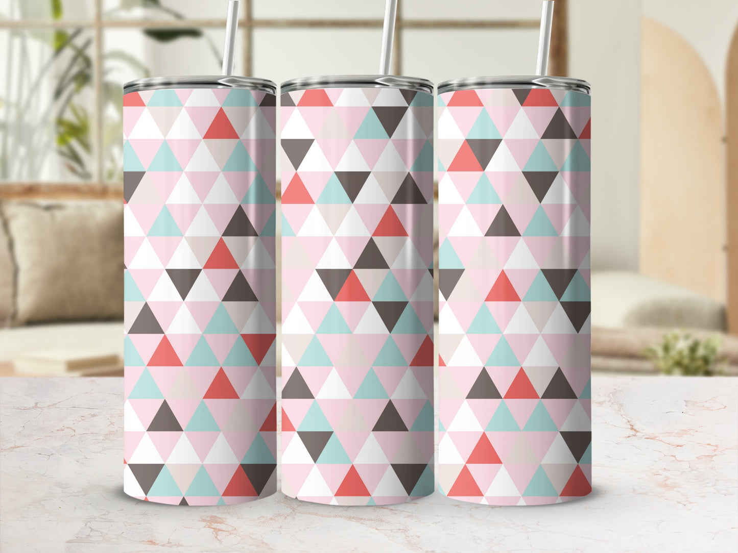Three tumblers with pink, blue, gray, and coral geometric triangle pattern.