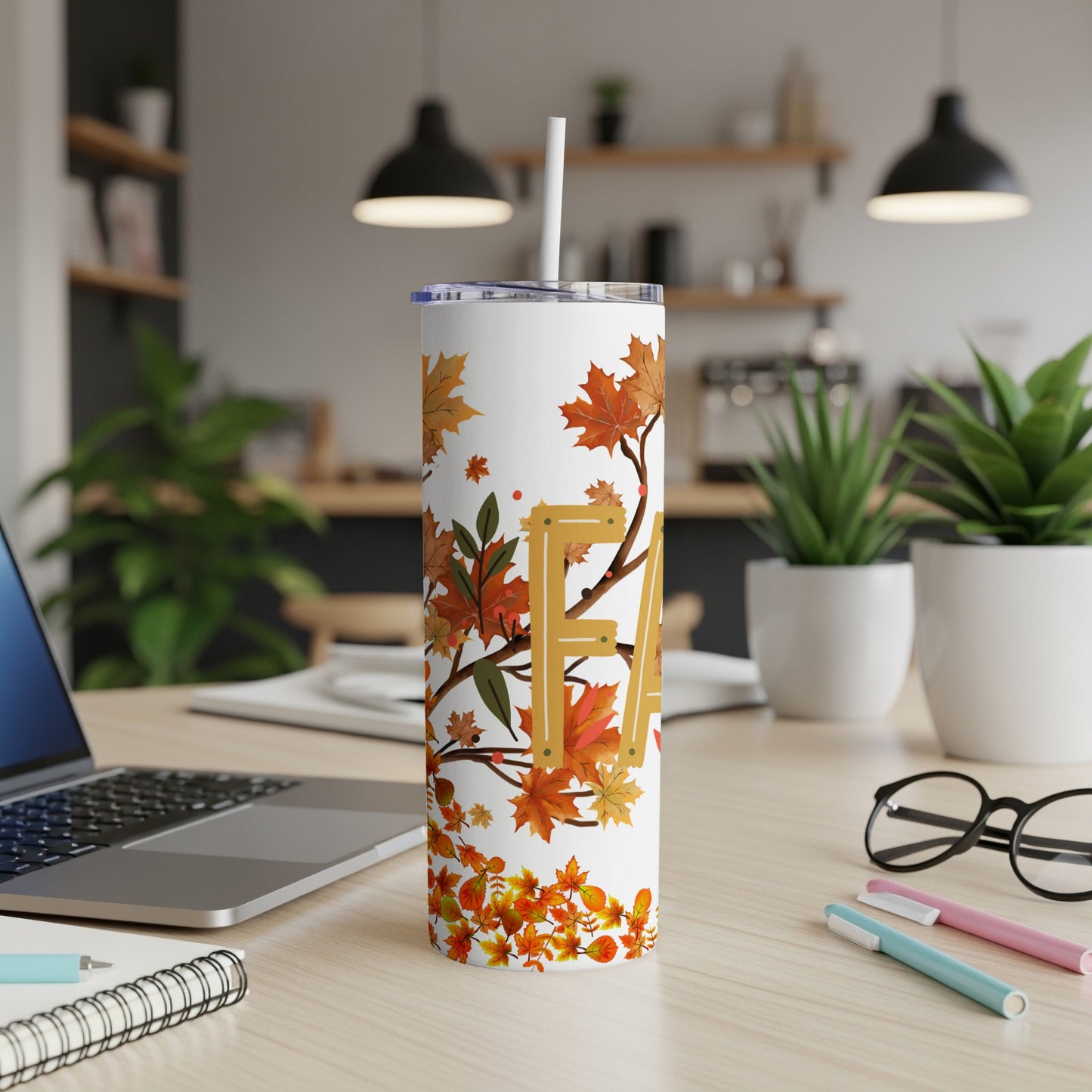 White tumbler with fall leaves pattern and "FA" text.
