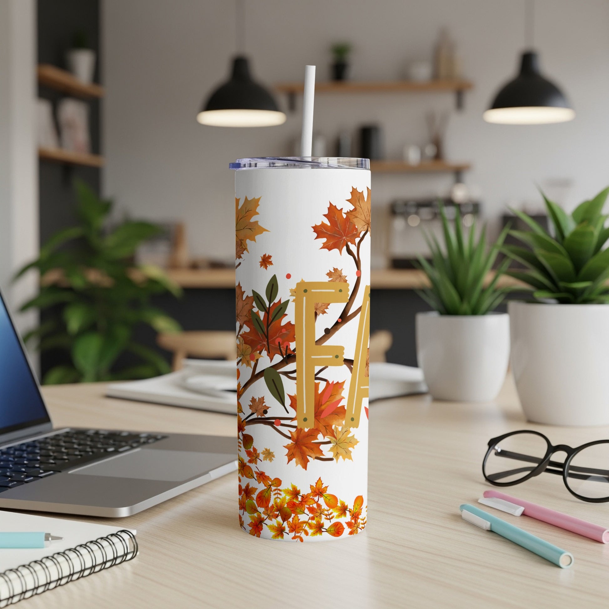 White tumbler with fall leaves pattern and "FA" text.