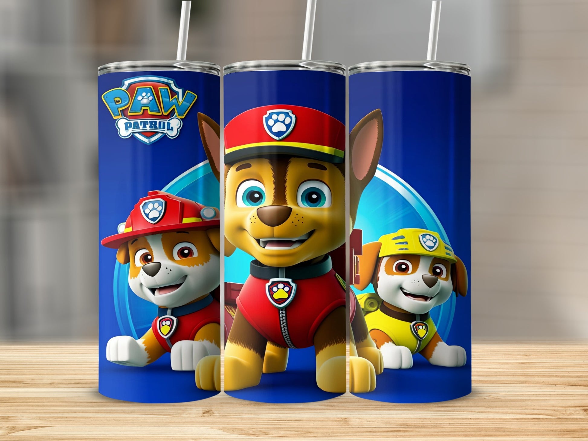 Paw Patrol Chase, Marshall, and Skye puppies on blue tumbler.