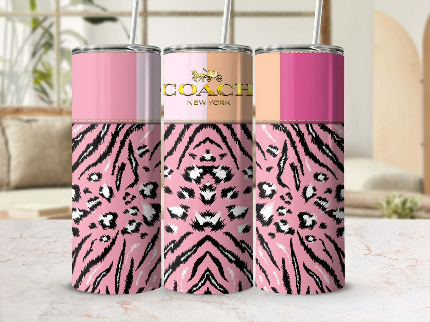 Three pink tumblers with tiger and leopard print, one with a Coach New York logo.