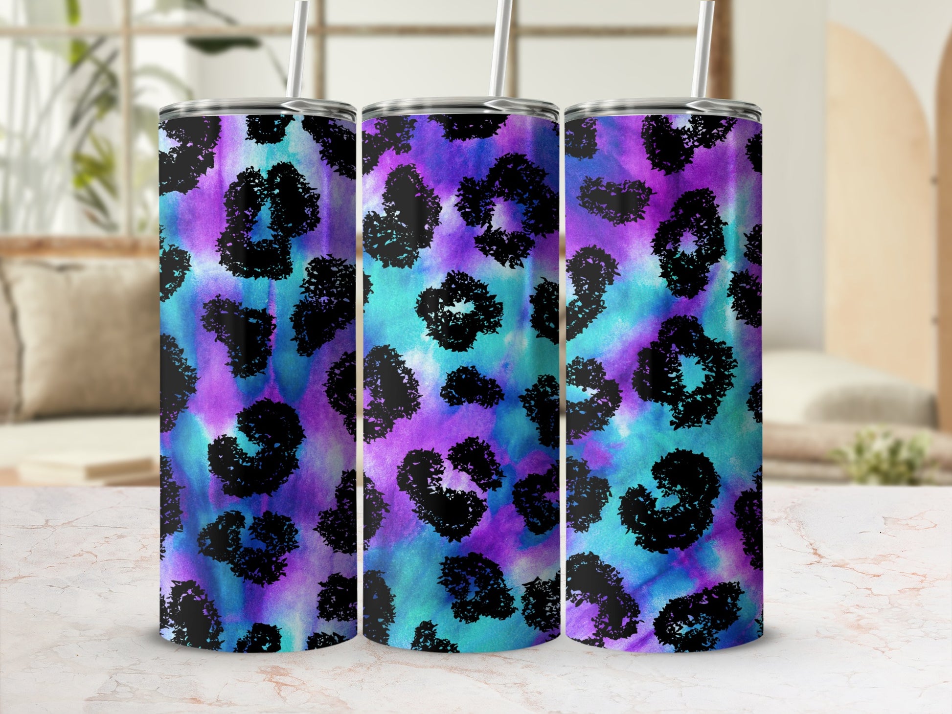 Tumbler with black leopard print on a blue and purple gradient background.