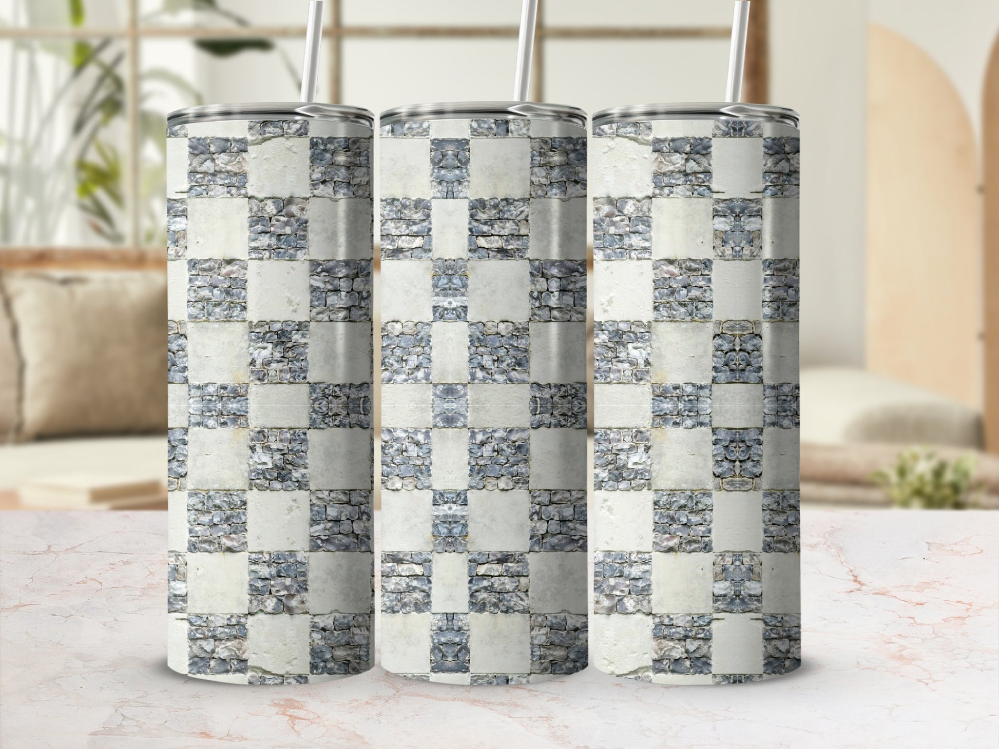 Three tumblers with a stone checkerboard pattern against a blurred background.