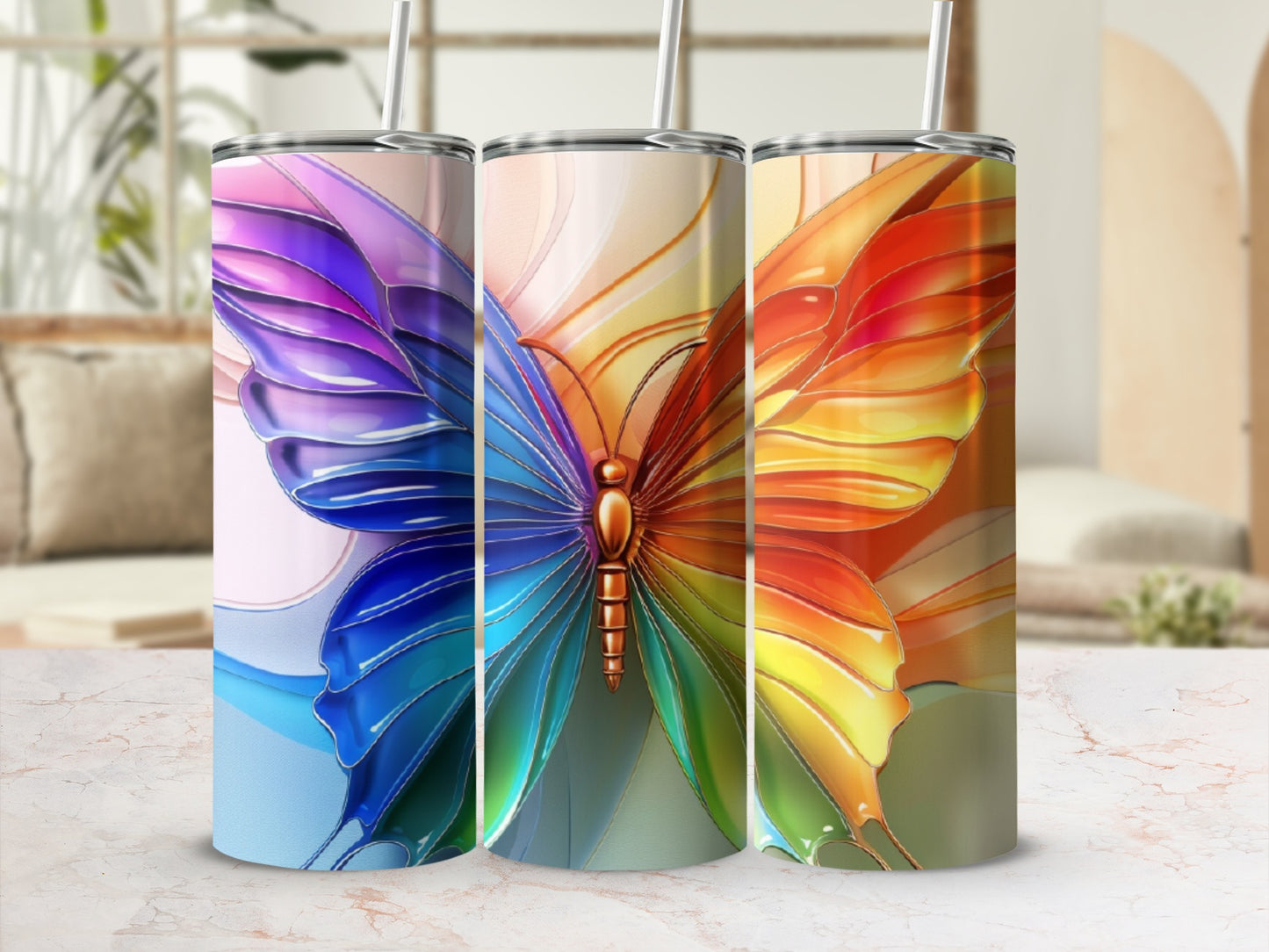 Three tall tumblers with iridescent butterfly wings design.