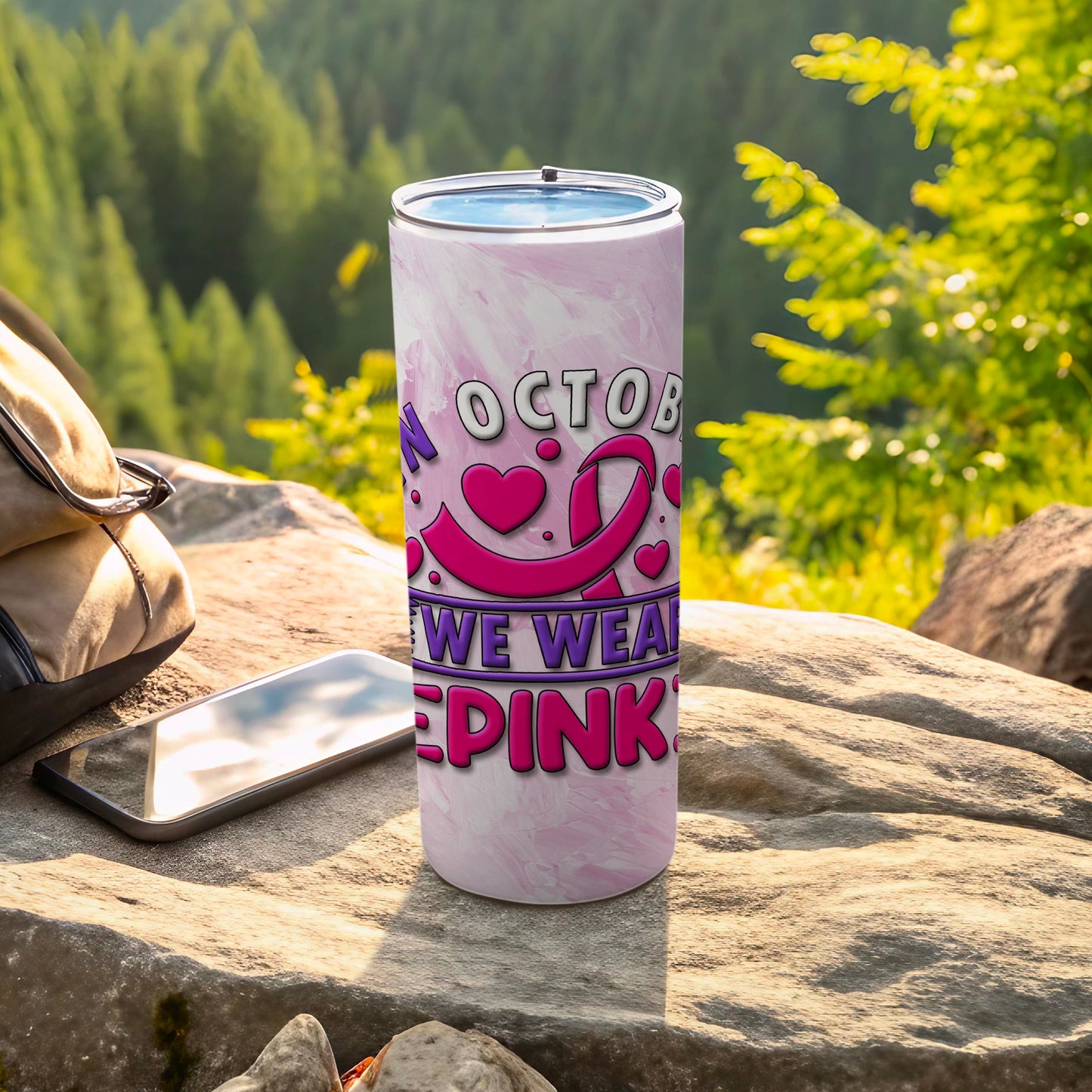 Pink marbled tumbler with "October we wear pink" and breast cancer ribbon graphic.