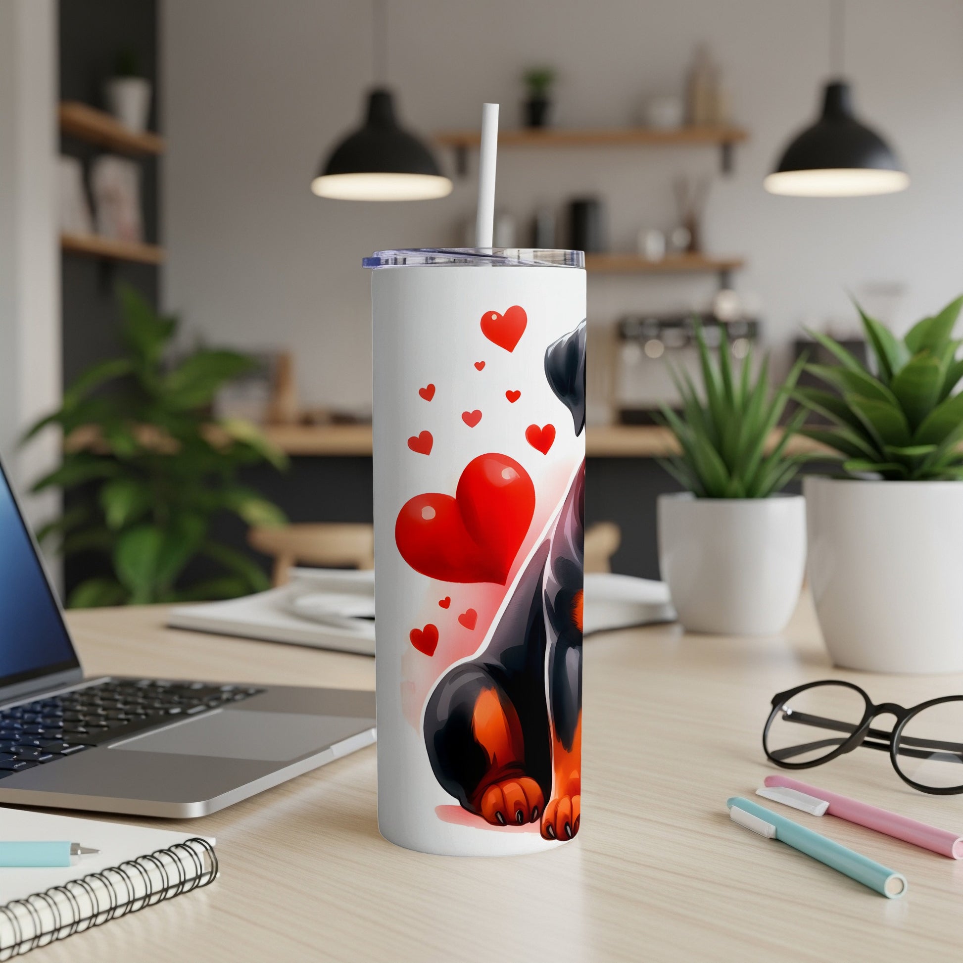 Rottweiler with hearts design on a white tumbler with a straw.