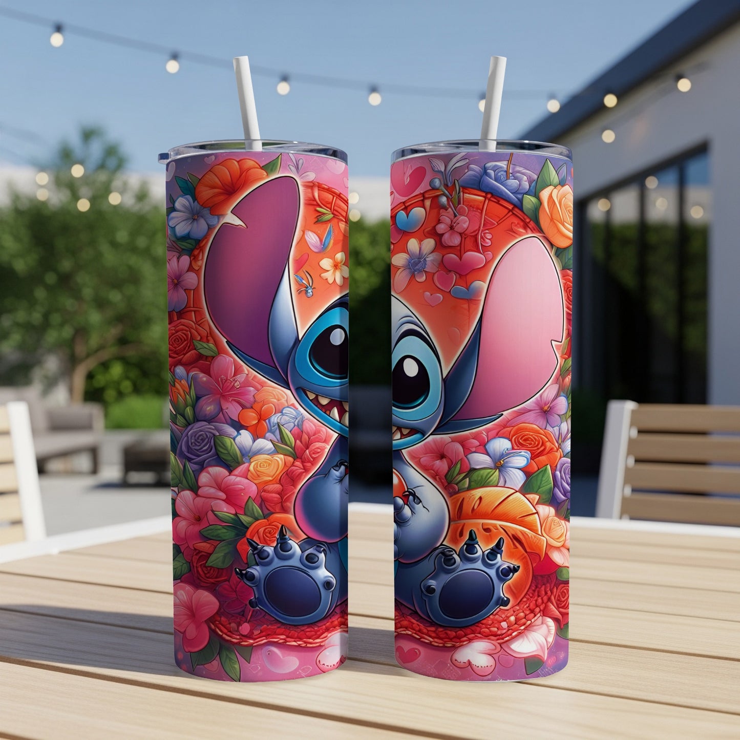 Stitch with heart-shaped flowers and swirls on a tumbler with a straw.