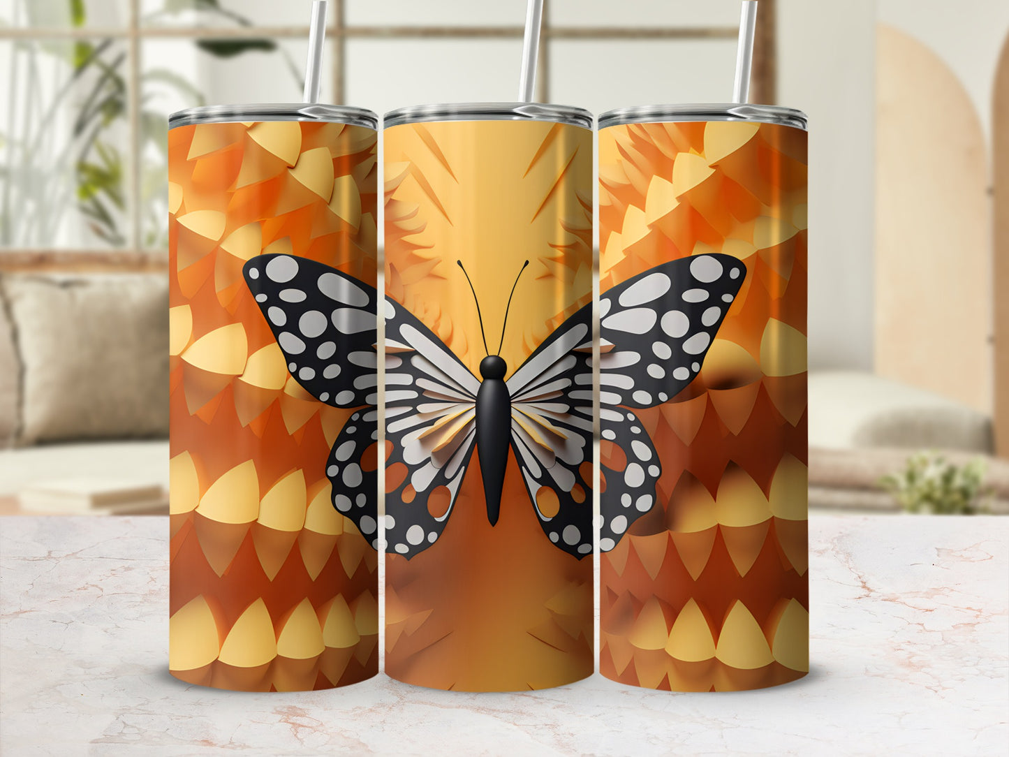 Three tumblers with orange and yellow scales and a black and white butterfly design.
